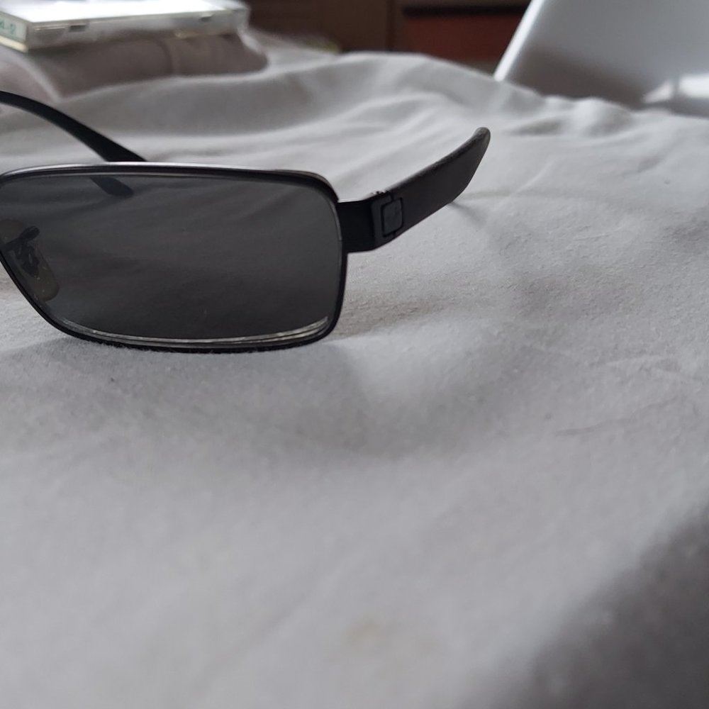 Brand new ray bans sun glasses with matte black temples and emblem on sides